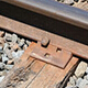 rail spike with base plate above the tie